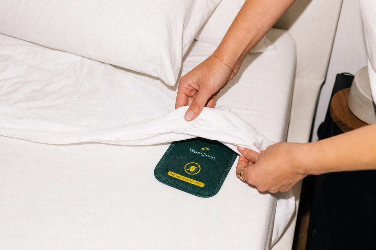 Sliding a card under the fitted sheet
