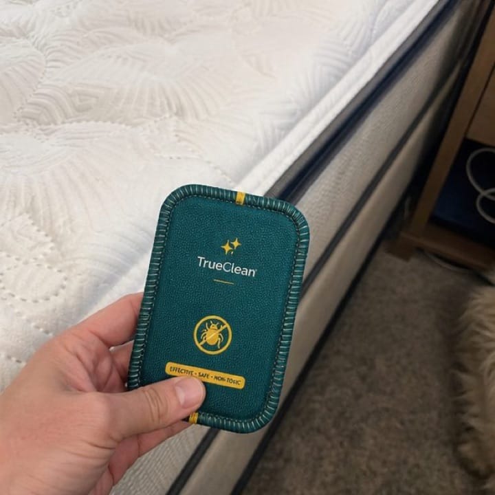 Customer holding a CaptureCard near the mattress edge